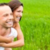 Smiling Couple On Grass