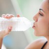 Woman Drinking A Bottle Of Water