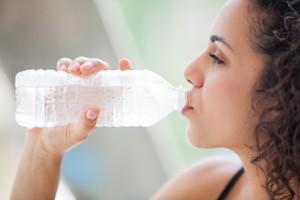 Woman Drinking A Bottle Of Water