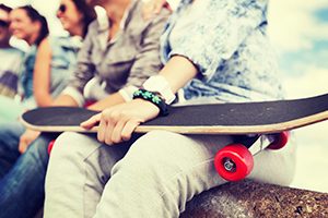 Teenager Holding A Skate