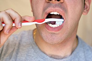 Man Brushing his Teeth