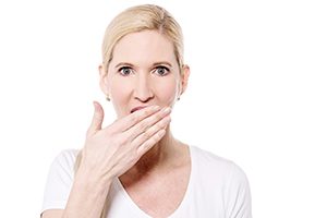 Woman Covering her Mouth