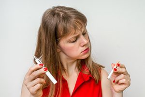 Woman with Cigarette and Vaporizer