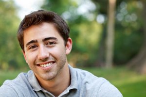 Young Man Smiling Outside 
